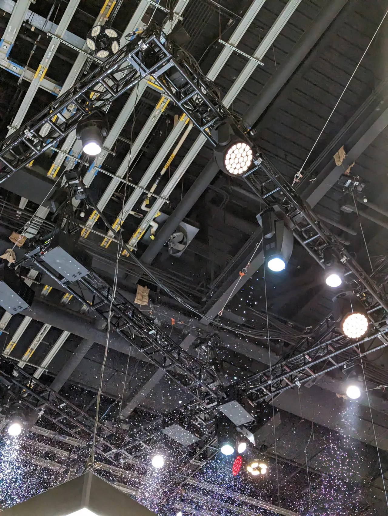 Lighting truss and moving lights above an event venue