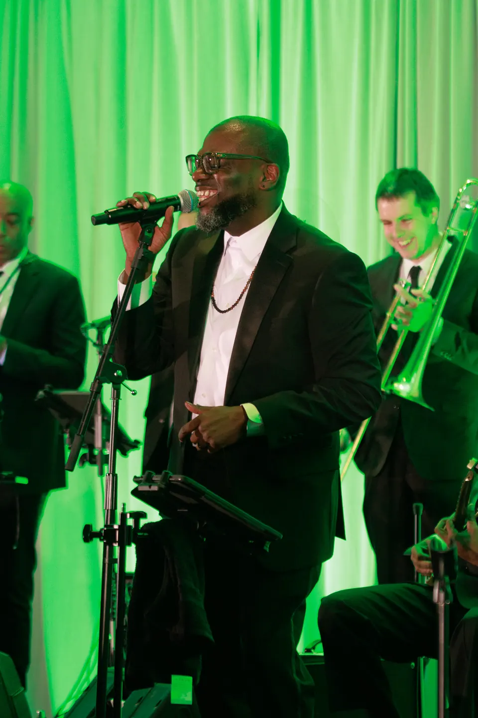 Vocalist performing with a trombonist during a Moles Conclave concert
